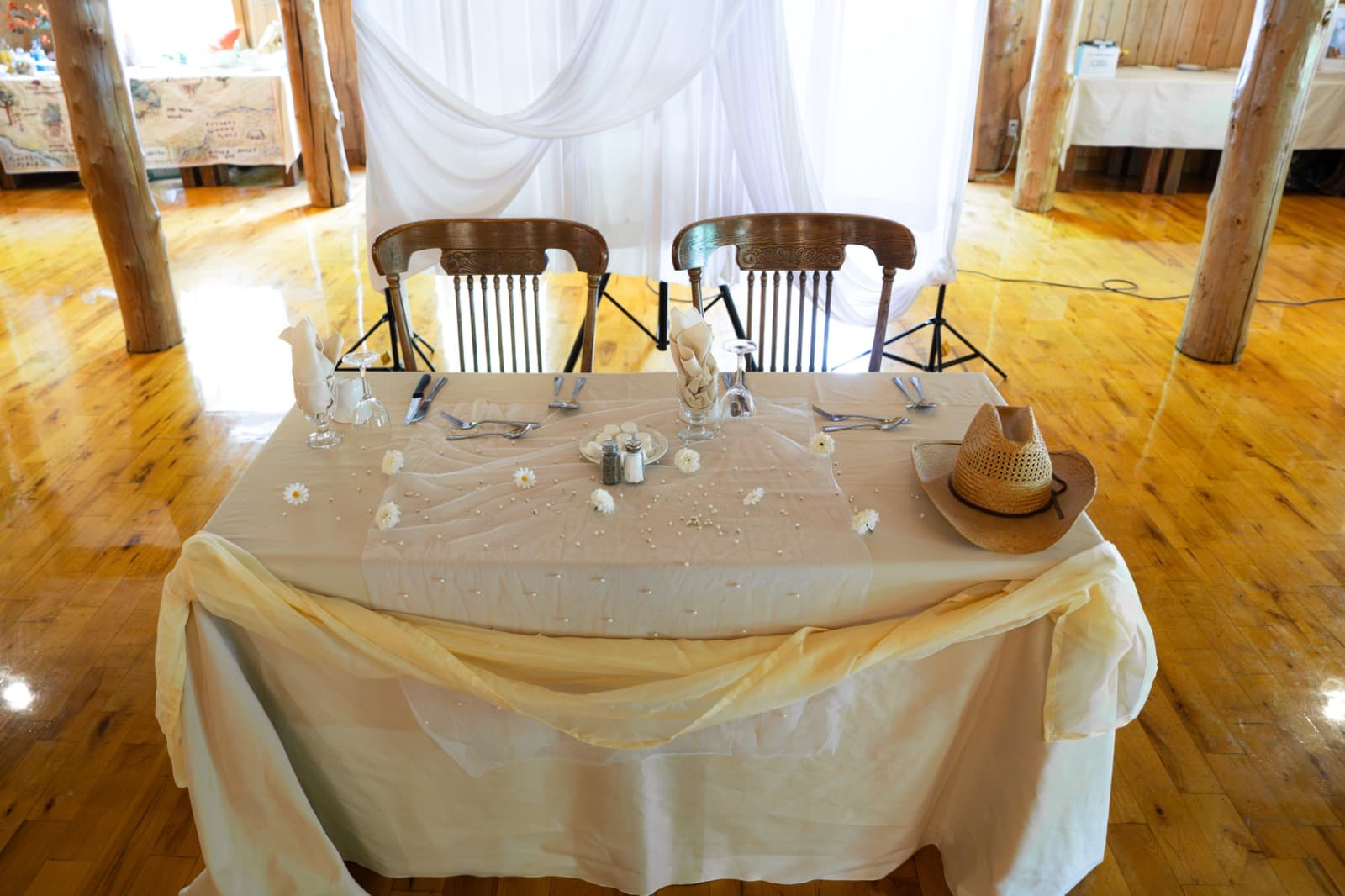 Sweetheart table set in the solid wood reception hall